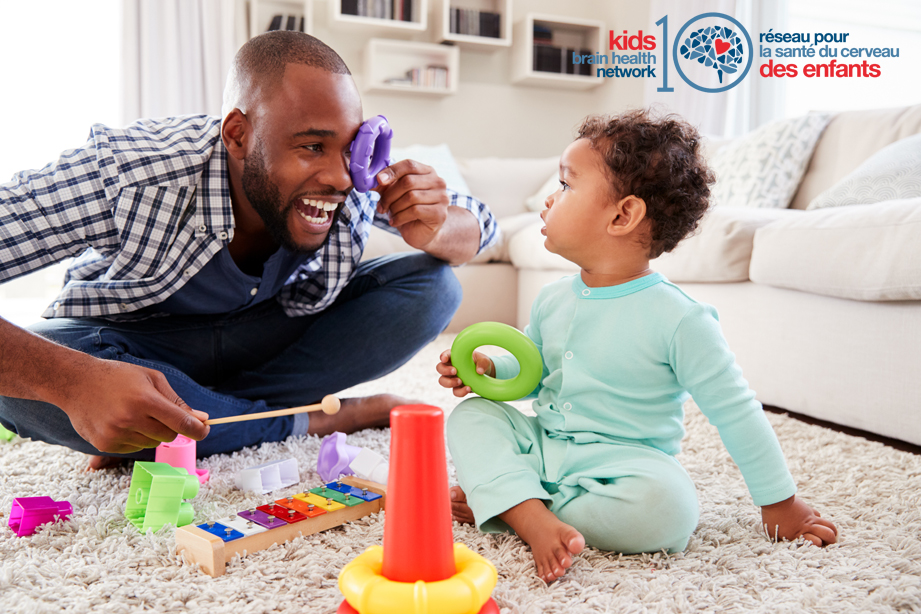 Father playing with his toddler