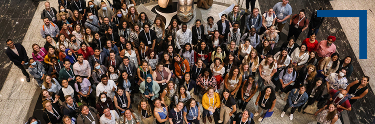 An overhead indoor image of trainees and members of the KBHN team