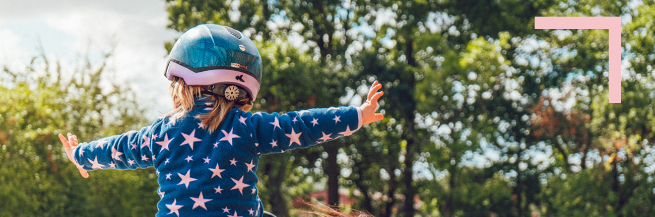 Child rides a horse for therapeutic riding