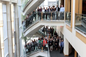 An indoor image of the KBHN Board, research presenters and staff team, standing on the staircase at SFU’s Morris J. Wosk Centre for Dialogue on Research Day