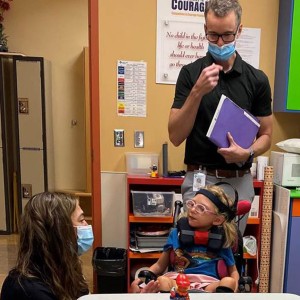 Girl in Wheelchair Getting Help