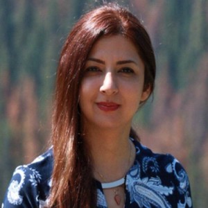 Behnaz Bahmei, female, is smiling at the camera.